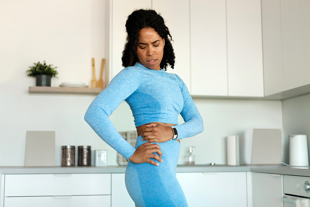 Why is one of your hips tighter than the other? 4 potential explanations dissatisfied fit black lady holding aching hip ha 2022 12 16 07 32 52 utc Why is one of your hips tighter than the other? 4 potential explanations