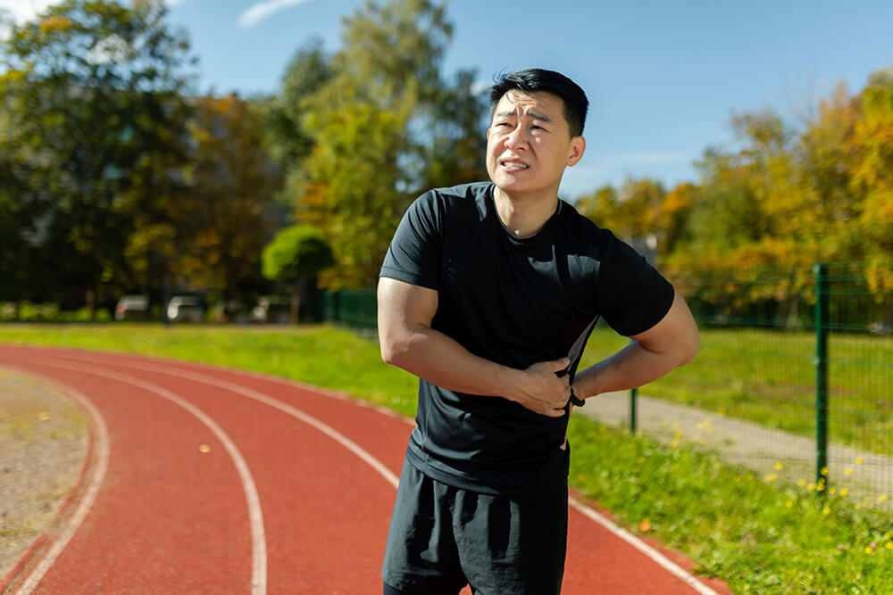 4 common types of soft tissue injury and how PT can help them asian sportsman has severe pain in back and abdomi 2023 11 27 05 14 27 utc 4 common types of soft tissue injury and how PT can help them